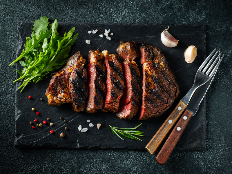 Grilled ribeye steak with seasoning