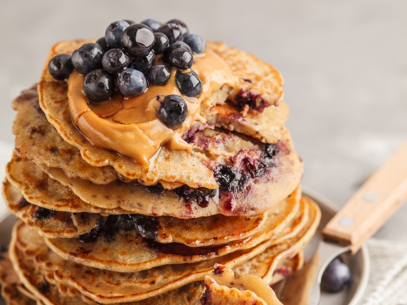 Vegan peanut butter blueberry pancakes and syrup